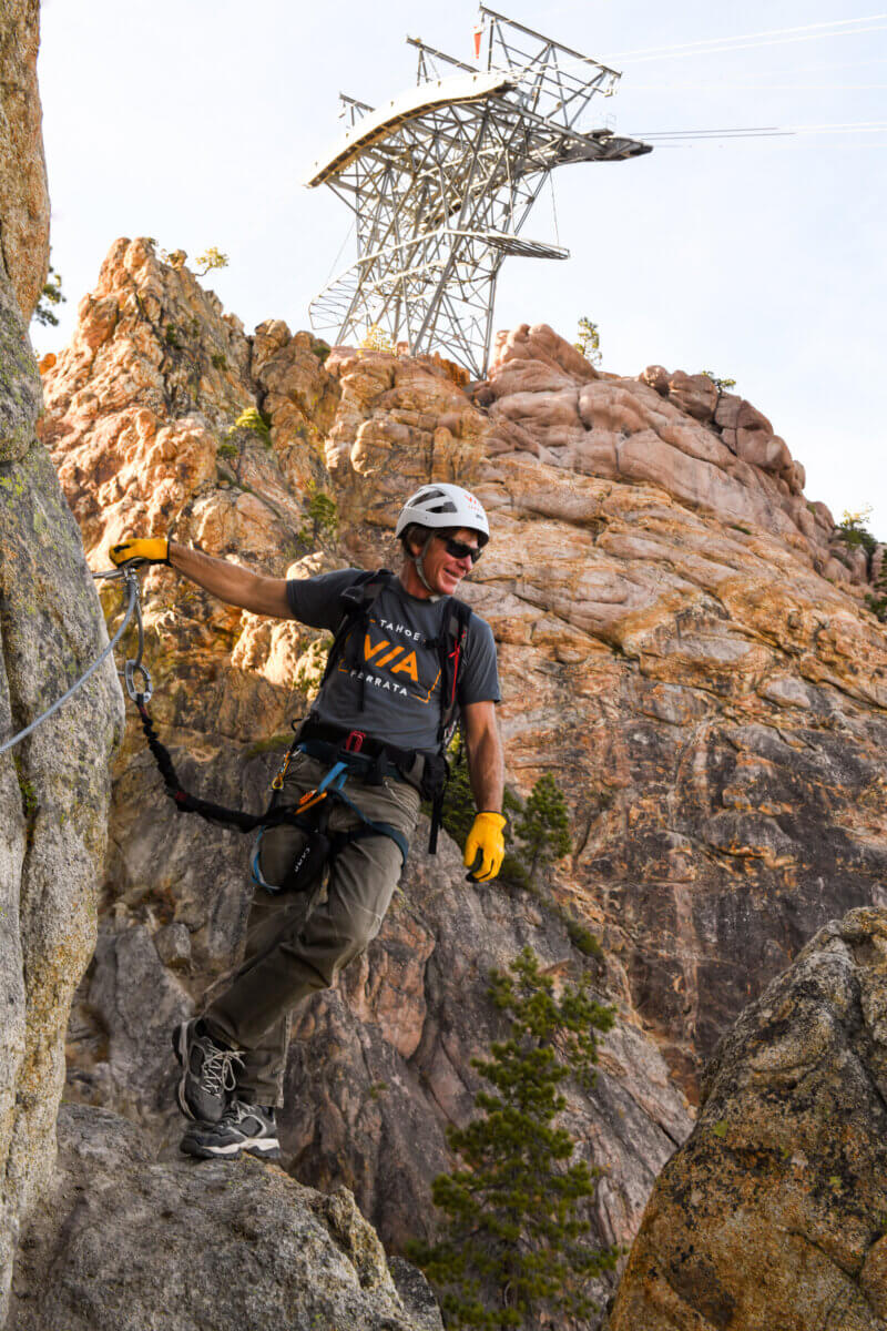 Alpenglow Expeditions' guide Dave Nettle climbing the Tahoe Via Ferrata at Palisades Tahoe in Olympic Valley. One of the best Lake Tahoe adventures!