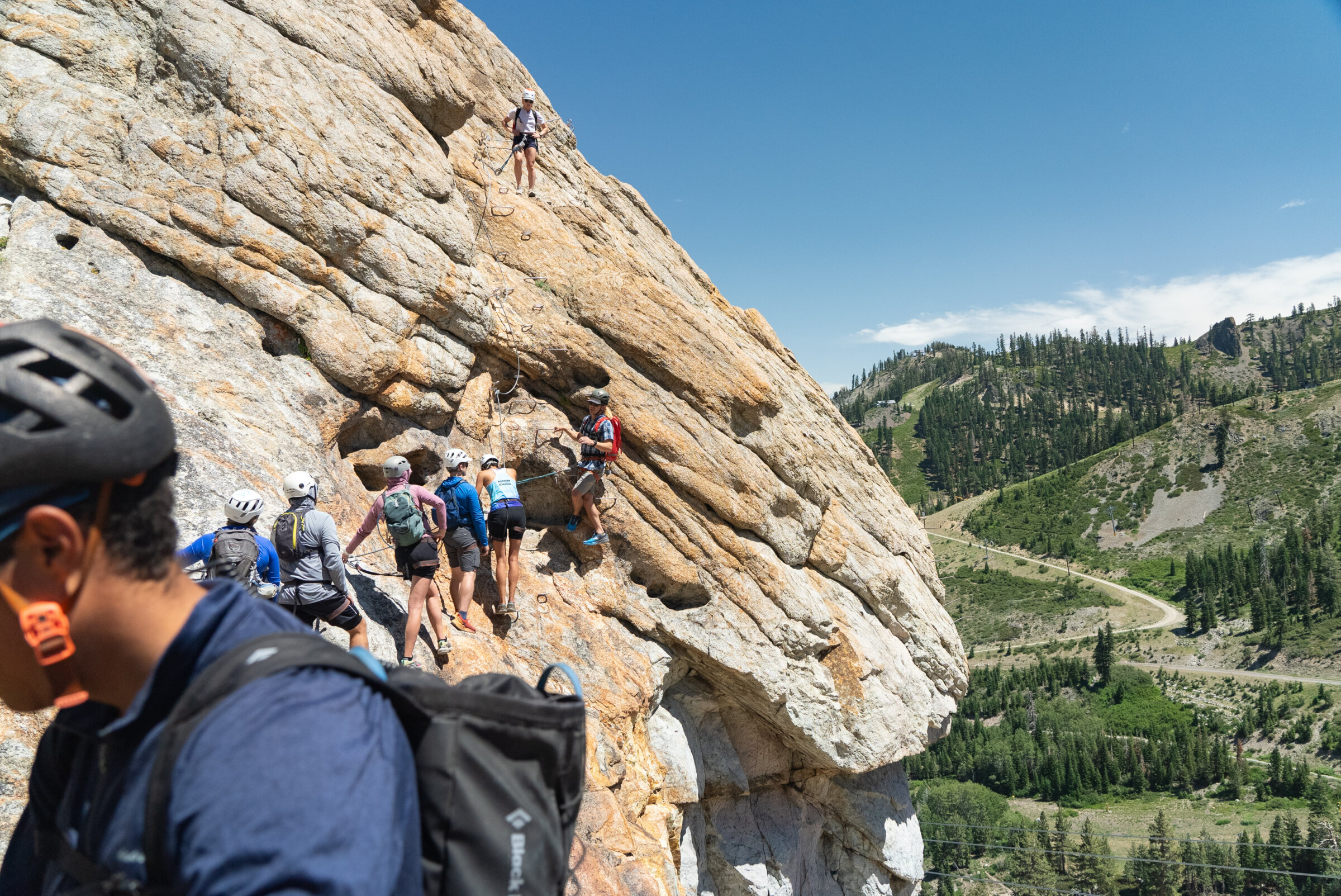 A large group climbing on the Tahoe Via in Lake Tahoe, CA. One of the best Lake Tahoe adventures!