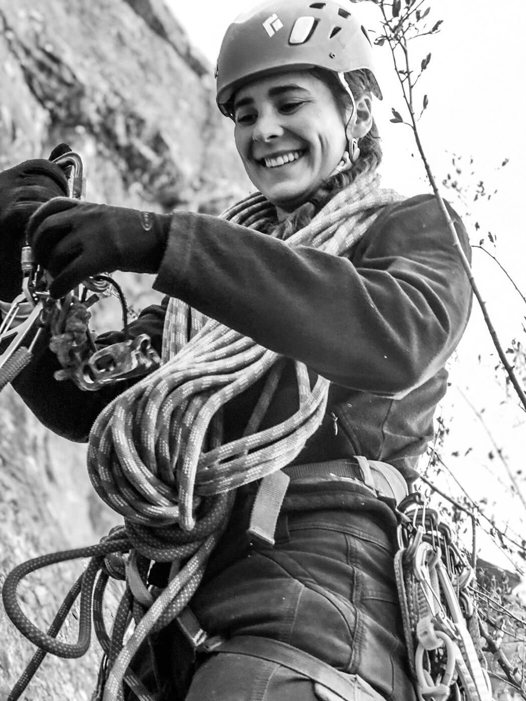 Alpenglow Expeditions' Tahoe Via Ferrata guide Emily Sotomayor sorting her rock climbing gear.